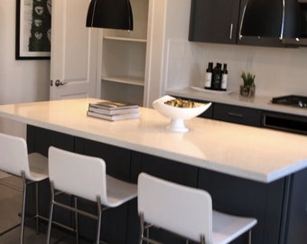 5ft black island with white quartz top. Custom welcome