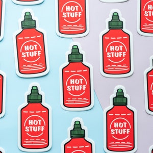 May include: Ten red and white hot sauce bottle stickers with the text "HOT STUFF" in a white circle on each sticker.