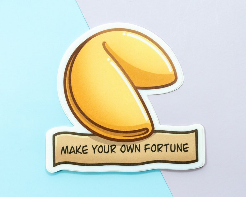May include: A white sticker with a cartoon illustration of a fortune cookie and the text "Make your own fortune".