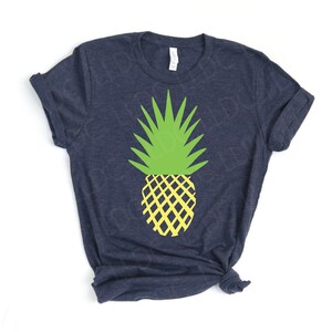 May include: A navy blue t-shirt with a yellow and green pineapple graphic.