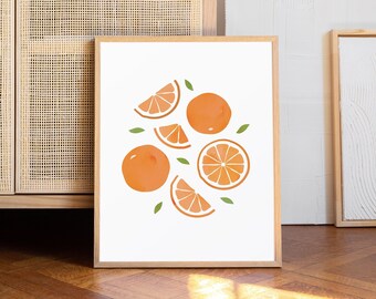 May include: A framed print with a white background and a watercolor illustration of orange slices and whole oranges with green leaves.