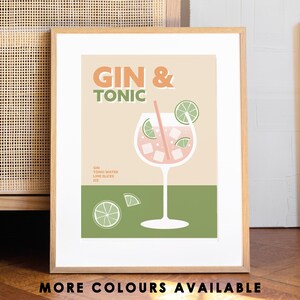 May include: A printable art print with a retro-style illustration of a gin and tonic cocktail. The text "GIN & TONIC" is in orange and brown letters. The drink is in a tall glass with a lime wedge and a straw. The background is a light peach color with a green stripe at the bottom.
