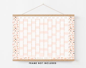 May include: A wall calendar for 2026-2027 featuring a grid layout with months from September to August. The design includes a light pink and cream terrazzo pattern on the side borders, held by wooden rails with a string for hanging.