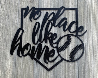 May include: Black metal home decor sign shaped like a baseball diamond with the text "no place like home" and a baseball graphic.