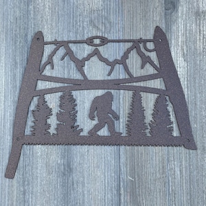 Timber Legend: Vintage Bow Saw with Bigfoot Metal Sign Cutout - Sasquatch Sign