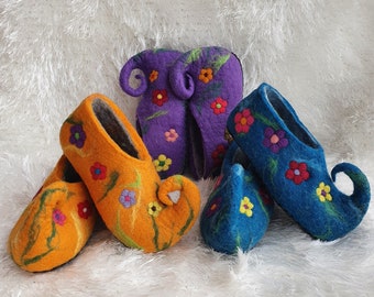 May include: Four pairs of felt slippers with floral embroidery. Two pairs are orange with green stems, one pair is purple with green stems, and one pair is blue with green stems.
