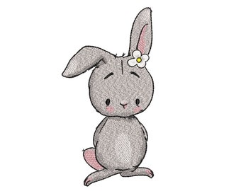 Puede incluir: Un conejo gris de dibujos animados con una flor blanca en la cabeza. El conejo tiene acentos rosas en las orejas, las mejillas y la cola. El conejo está de pie sobre sus patas traseras y tiene una expresión dulce.