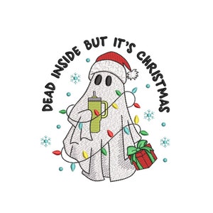 May include: A white ghost wearing a red Santa hat and holding a green cup with a straw. The ghost is decorated with colorful Christmas lights and is holding a red gift box with a green bow. The text "Dead inside but it's Christmas" is written in a circle around the ghost.