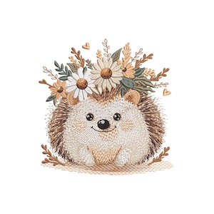 May include: Embroidered design of a brown hedgehog wearing a crown of white daisies and green leaves. The hedgehog is smiling and has a brown nose.