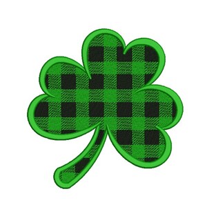 Pode incluir: Um trevo verde com um padrão xadrez preto e verde. O trevo é contornado em verde.