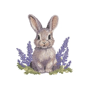 May include: A cute gray bunny rabbit sitting in a patch of purple flowers. The bunny has brown ears and a white nose.