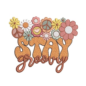 May include: Embroidered design with the text "Stay groovy" in orange and brown. The text is surrounded by a variety of colorful flowers and peace signs.