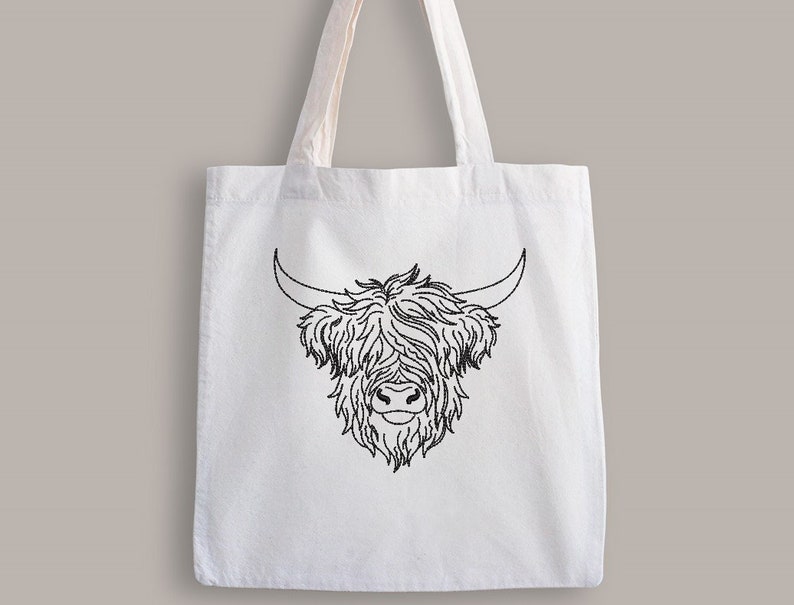May include: White tote bag with a black line drawing of a Highland cow head.