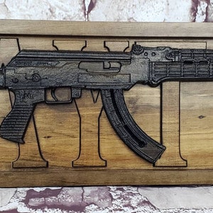 AK-47 Replica With Last Name Behind It