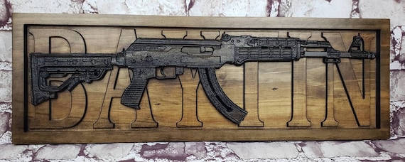 AK-47 Replica With Last Name Behind It
