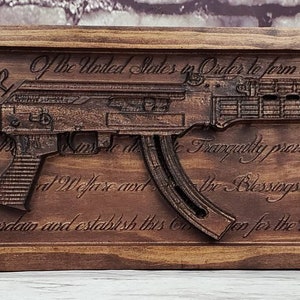 AK-47 Replica With Constitution Behind It