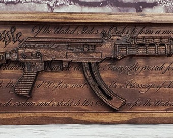 AK-47 Replica With Constitution Behind It