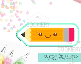 May include: A yellow pencil cookie cutter with a smiling face and a red eraser. The cutter is 3D printed and is part of a set of custom cookie cutters. The cutter is on a white background with colorful sprinkles.