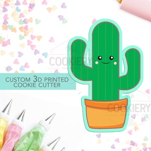 Peut inclure: Un emporte-pièce en 3D imprimé en forme de cactus dans un pot avec un visage souriant. L'emporte-pièce est conçu pour faire des biscuits.