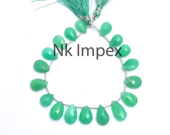 May include: A strand of 18 green gemstone beads in a pear shape. The beads are strung on a silver wire and have a silver clasp. The beads are approximately 10mm in length.