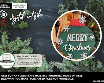 May include: Digital cut files for a Christmas ornament design. The ornament is a green circle with the words "Merry Christmas" in white lettering. The ornament is surrounded by white snowflakes.