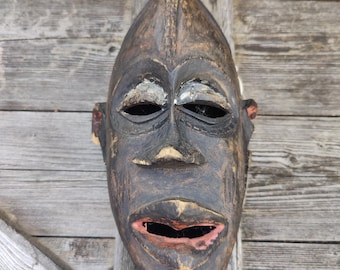 Old, distressed African mask