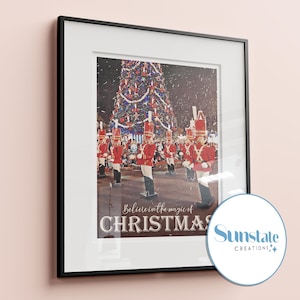 May include: A framed print of a Christmas scene with a large decorated Christmas tree and a marching band of toy soldiers. The print has the text "Believe in the magic of Christmas" and a logo for Sunstate Creations.