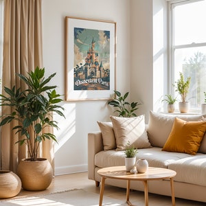 May include: A beige living room with a white couch, a coffee table, and a framed poster of Disneyland Paris. The poster features a vintage-style illustration of the iconic castle.