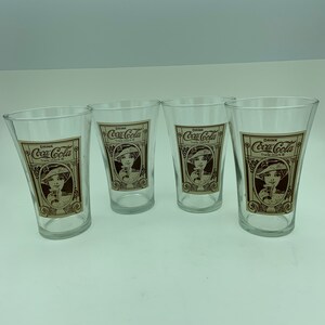 Set Of Four The Coca Cola Company Archives Recreation Of A Design From The Turn Of The Century 16 Ounce Flaired Drinking Glasses Tumblers