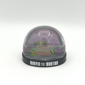 Vintage Looney Tunes Marvin The Martian And Pet K-9 Alien Dog On Rocket Spaceship Small 3 Inch Plastic Souvenir Glitter Snow Globe