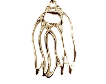May include: Gold-toned pendant necklace featuring a detailed, abstract design resembling a stylized animal silhouette.