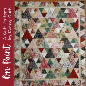 May include: A quilt pattern titled "On Point - A Quilt Pattern by Darcy Quilts" featuring a patchwork quilt with a red, green, white, and black color scheme. The quilt is made of triangles and has a border.