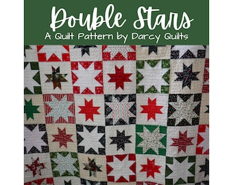 May include: A quilt pattern called "Double Stars" by Darcy Quilts. The quilt is made of red, white, green, and black fabric with a star pattern.