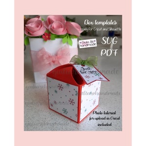 May include: A red and white box template with snowflake patterns, a green bow, and a tag that says "Just for you." The image also includes a white box with pink flowers and text that reads "Box templates ready for Cricut and Silhouette."