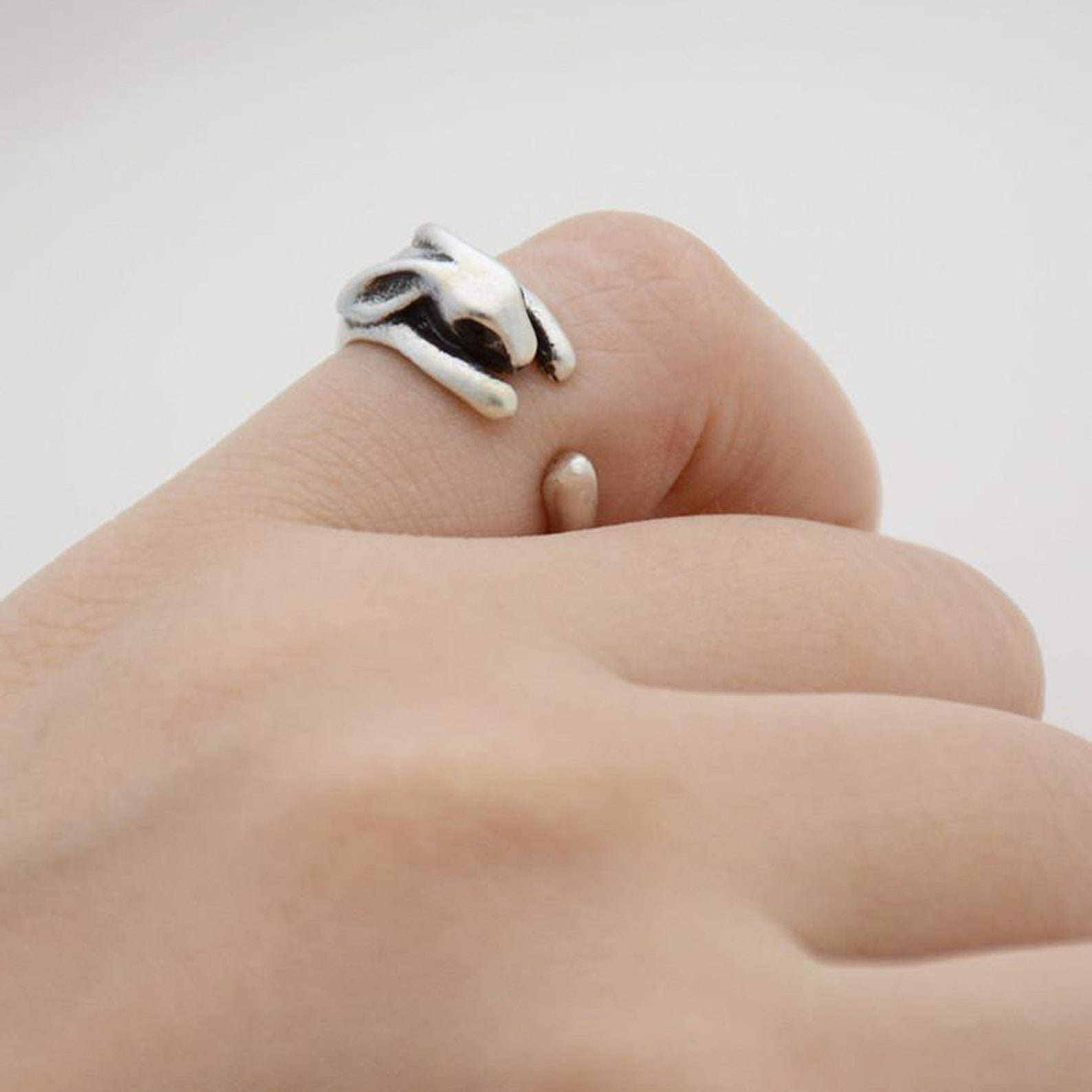 wrap around ring shaped like a bunny rabbit on a woman's finger