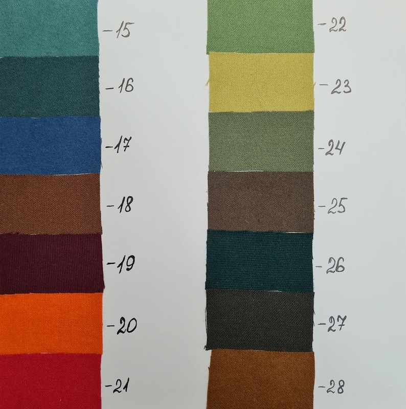 May include: A colour swatch chart featuring two vertical columns of rectangular fabric samples in various shades including teal, blue, brown, burgundy, orange, red, green, yellow, olive, and charcoal, each labelled with numbers 15 through 28.