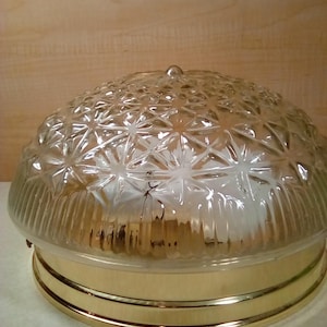 Clear glass globe brass color base ceiling light