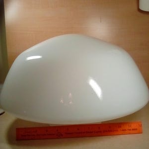 May include: White glass lampshade with a rounded, dome-like shape. The shade is approximately 12 inches in diameter.
