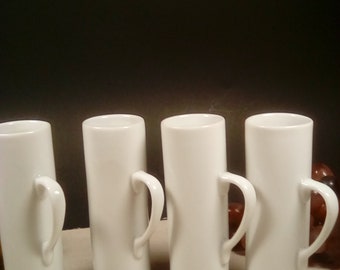 4 white shot glasses