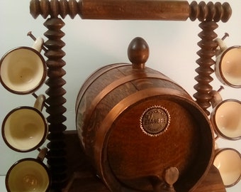 Coppered Copper and wood liquor barrel and 6 ceramic tiny cups.