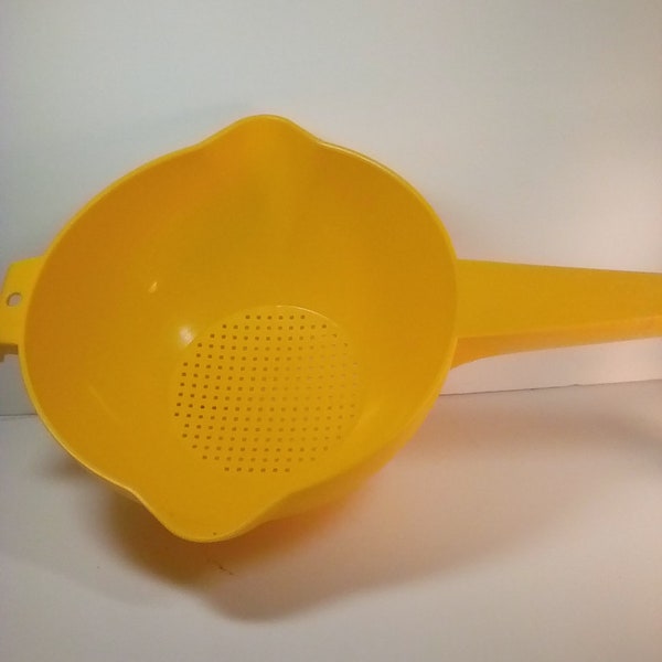 Yellow Tupperware strainer/ sifter