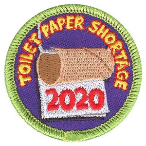 May include: A green and purple embroidered patch with the text "Toilet Paper Shortage 2020" and a cartoon image of a toilet paper roll.