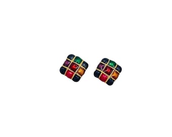 May include: A pair of square-shaped earrings with a grid pattern. Each earring features a black border, with colorful squares in red, green, purple, and gold. The squares are separated by thin gold lines.