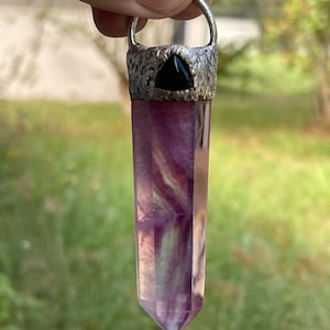 Magenta fluorite with black obsidian pendant