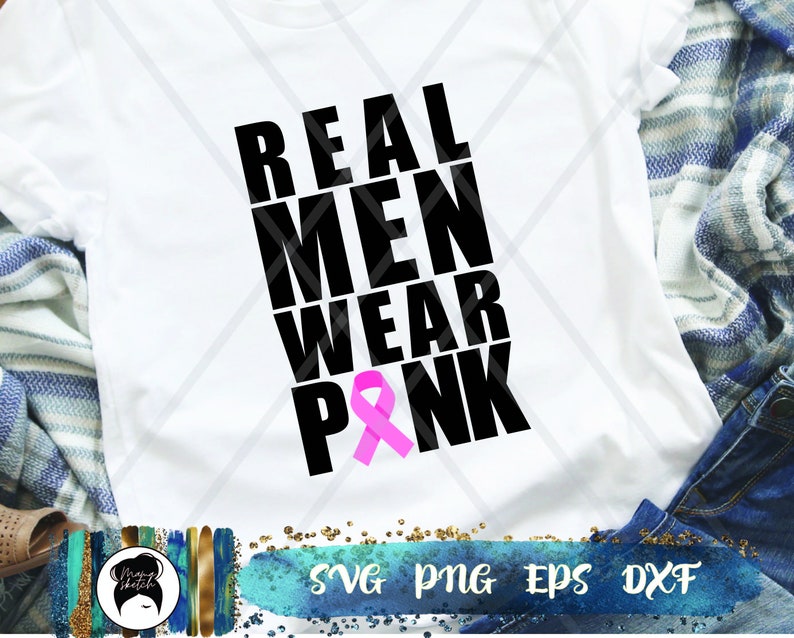 May include: White t-shirt with black text that reads "REAL MEN WEAR PINK" and a pink ribbon.