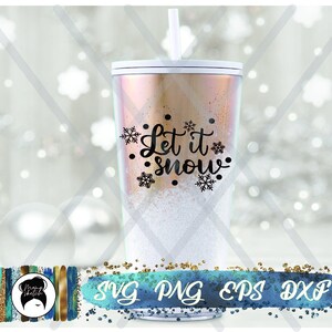 K&ouml;nnte beinhalten: Ein wei&szlig;er Becher mit goldener Glitzer-Oberfl&auml;che und einem schwarzen Design, auf dem "Let it snow" mit Schneeflocken steht.