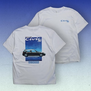 May include: Two white t-shirts. One shirt has "Civic Si" in blue on the front. The other shirt has a blue rectangle with "The All New Civic Si" and a black car graphic on the back, with "HONDA" below. The shirts are on a gradient blue background.