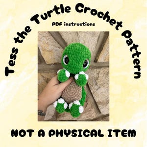 May include: A crochet pattern for a green turtle with white accents. The pattern is called "Tess the Turtle Crochet Pattern" and includes PDF instructions. The text "NOT A PHYSICAL ITEM" is also included in the image.