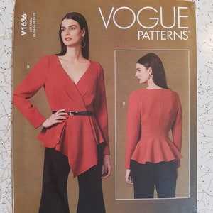 May include: Vogue Patterns sewing pattern featuring a red wrap top with a peplum and black pants. The pattern includes a front and back view of the top. The pattern number is V1636.