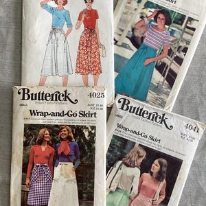 May include: A selection of vintage Butterick sewing patterns for wrap-and-go skirts. The covers display illustrations of the skirts in different designs and colours, with size and pricing information.